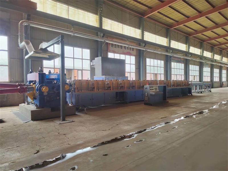 Induction heating system for rolling medium and small steel balls