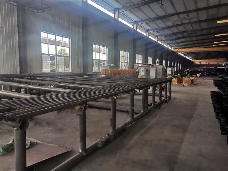 Induction heat treatment quenching and tempering production line for steel pipes and oil casings